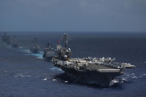 4 USS Kitty Hawk (CV 63) and ships from its carrier strike group steam in formation
